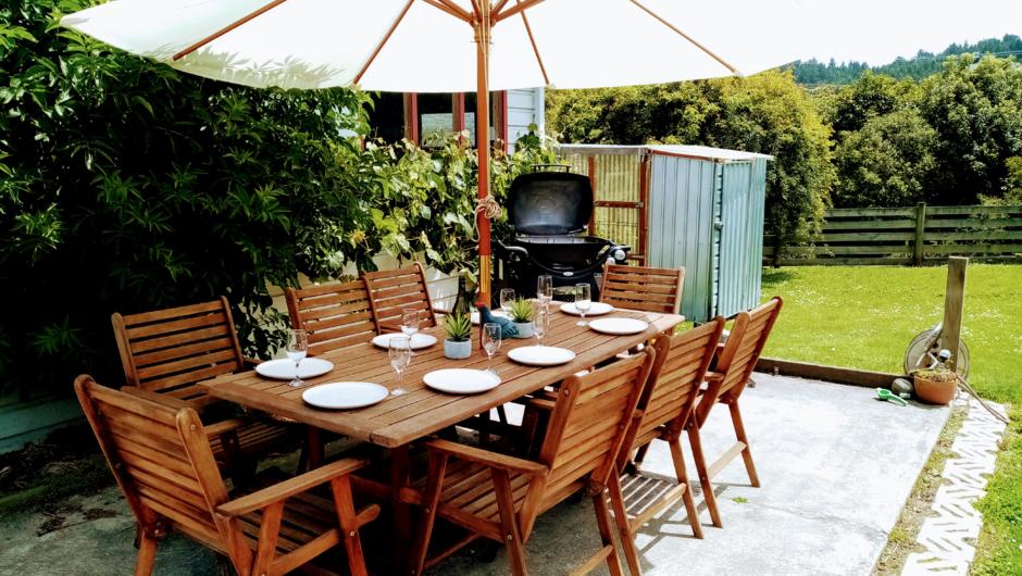 Outdoor dining with large Weber BBQ