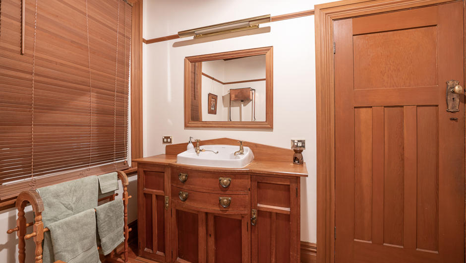The old maids bedroom has been converted to another bathroom featuring sanitary ware from McSkimming's own factory.