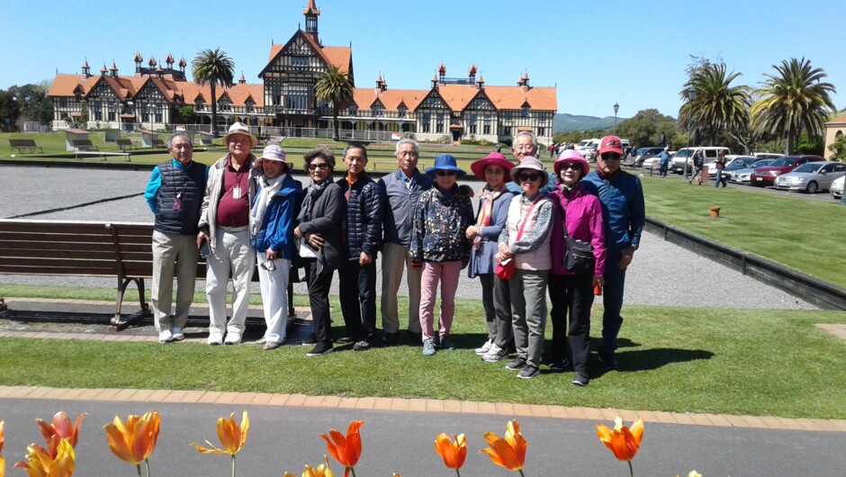 Tour group at Government Gardens, looking back to historc Bath-house