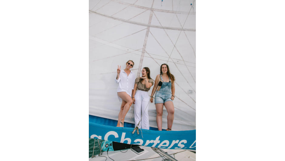 Girls having fun sailing on our private yacht charter