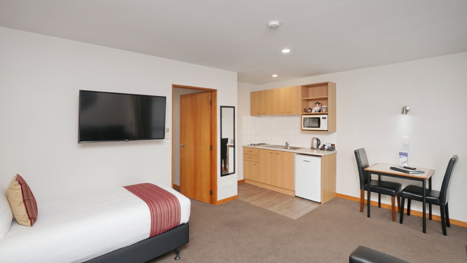 One bedroom kitchen lounge area. King bed in bedroom, single bed in lounge - available with a shower or a spa bath
