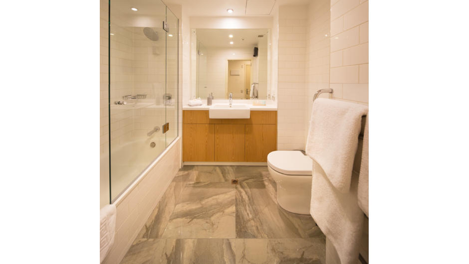 Modern bathrooms with heated floors, full sized baths and showers.