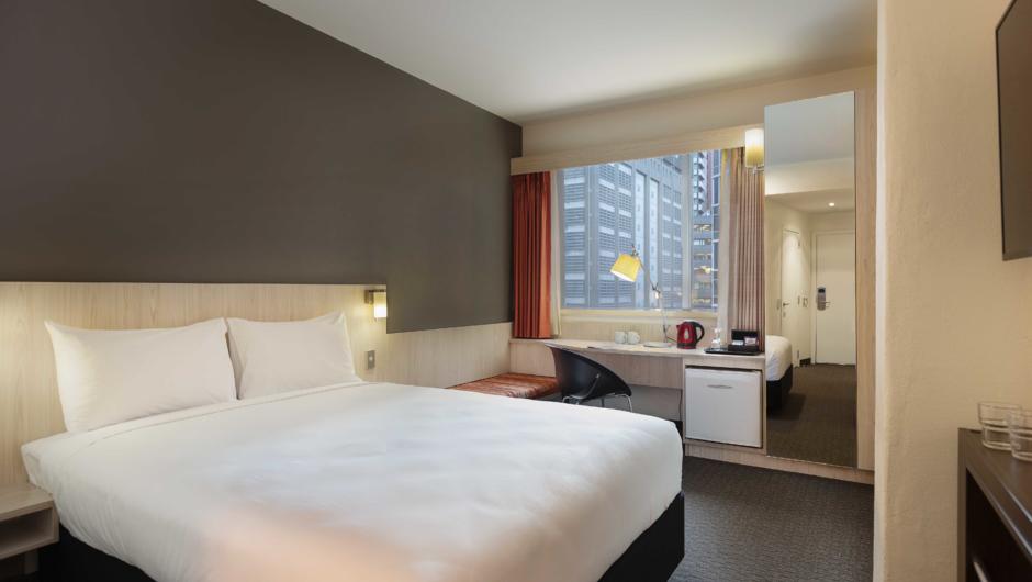A comfortable guest room with 1 King Bed or 2 Single Beds.