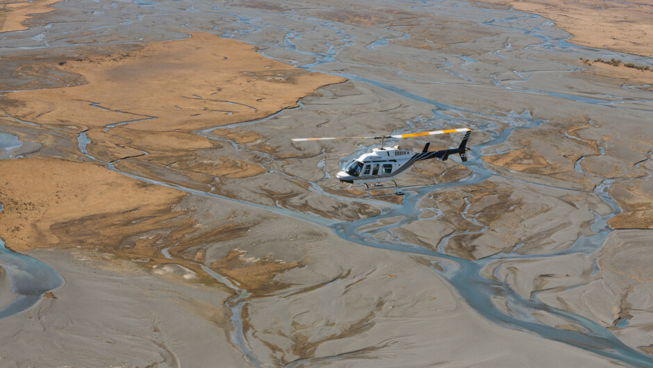 Heli flying over braided river system