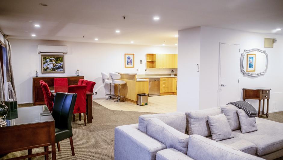 Boasting 125sqm of space, our Penthouse Suites have two large bedrooms, a large open-plan lounge, dining area, executive desk and fully equipped kitchen.

With a wrap-around balcony and sliding doors that open from the living and dining areas to the out
