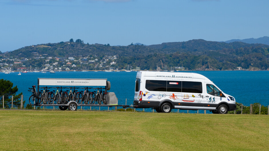 Northland Experiences luxury van and new, quality e-bikes on the trailer - Waitangi view point out to the Bay of Islands