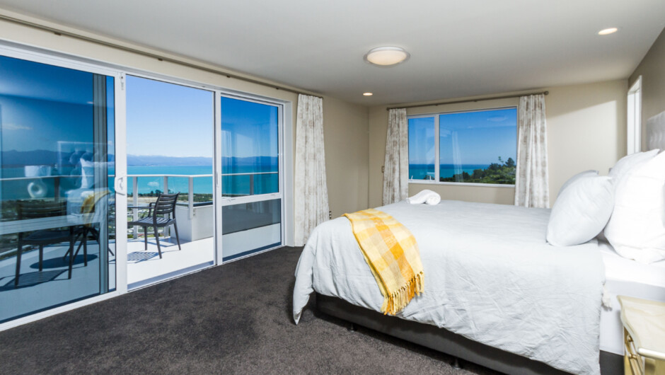 Masters bedroom with King bed and private balcony offering amazing sea & mountain views