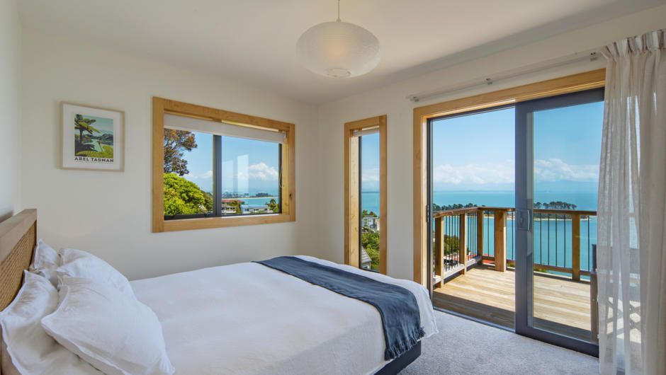 Masters bedroom with Queen bed and sea views.