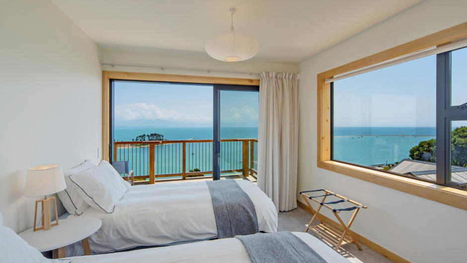Bedroom 2 with two Single beds (or King by early request) & incredible sea views.