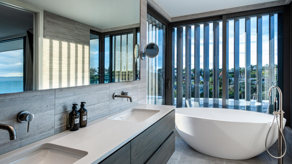 Double basin and freestanding oval bath in ensuite of Premier Ocean View Room.