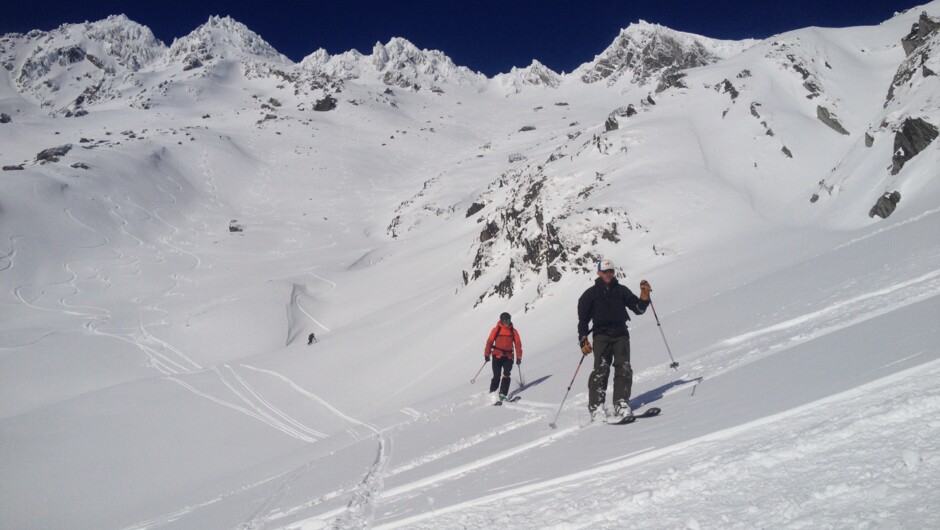 Skiiers return from the summit of Mt Larkins