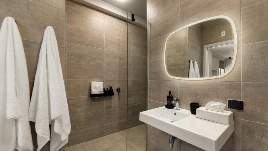 Modern tiled bathrooms with  luxury New Zealand made amenities.