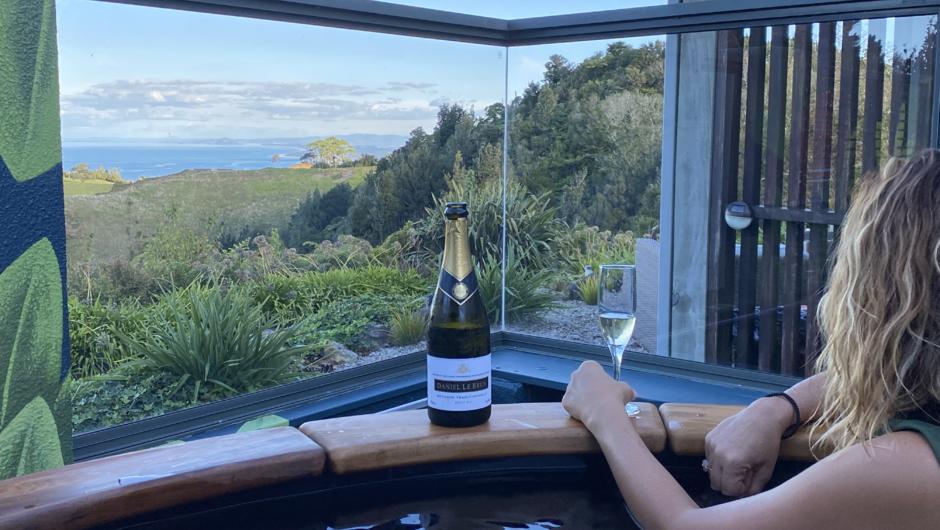 Spend your afternoon soaking in the outdoor hot tub with unbeatable views down the Bay of Plenty coastline.