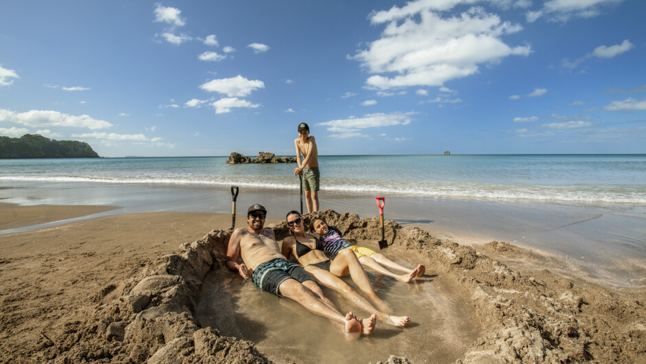 Digging your own natural Jacuzzi at Hot Water Beach