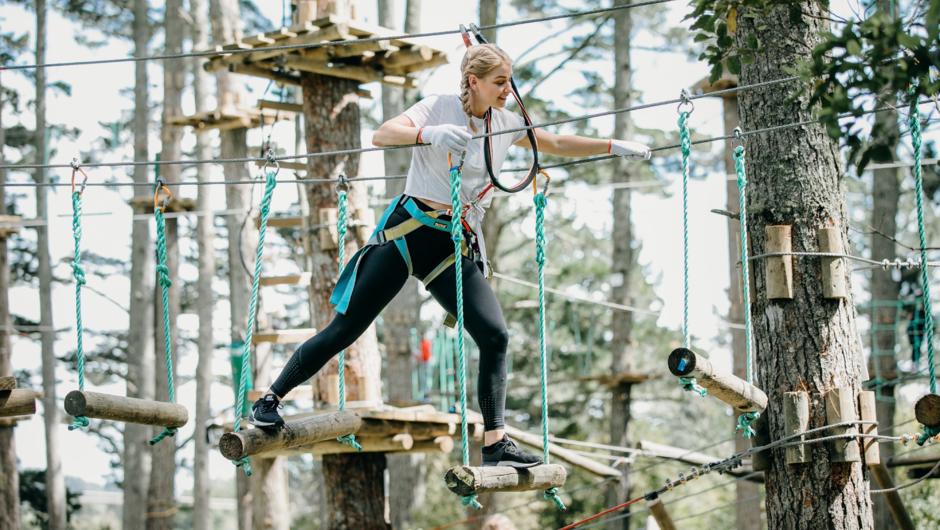 Challenge your balance on our Swinging Logs
