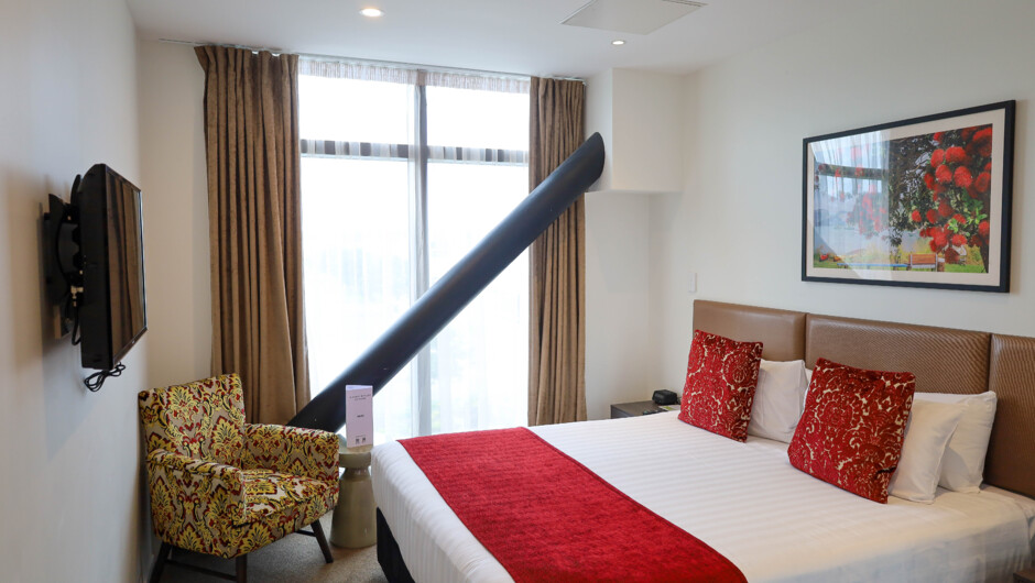 Hotel Deluxe Room.Well appointed hotel room offering a king bed and private bathroom. This room has everything you’d expect from a brand new hotel room including floor to ceiling windows and high quality sound proofing for a comfortable stay.