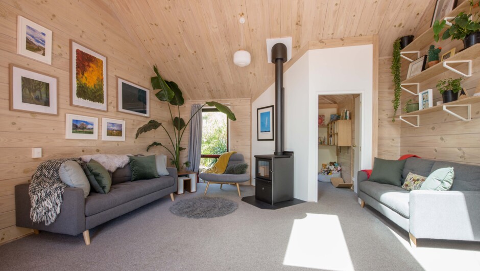 Cozy lounge with heatpump & wood burner