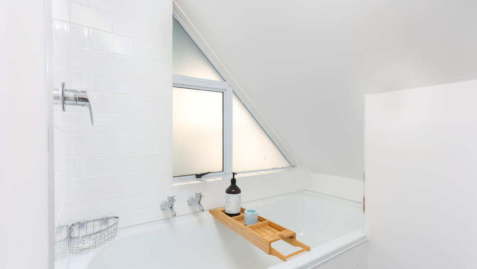 Upstairs bathroom with bath, toilet & vanity basin
