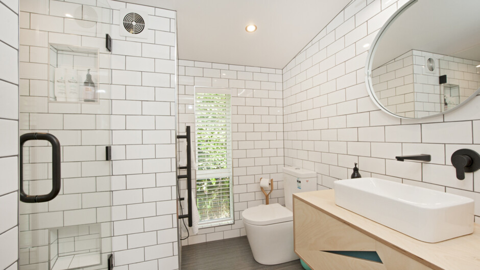 Stunning tile & frameless glass bathroom.
