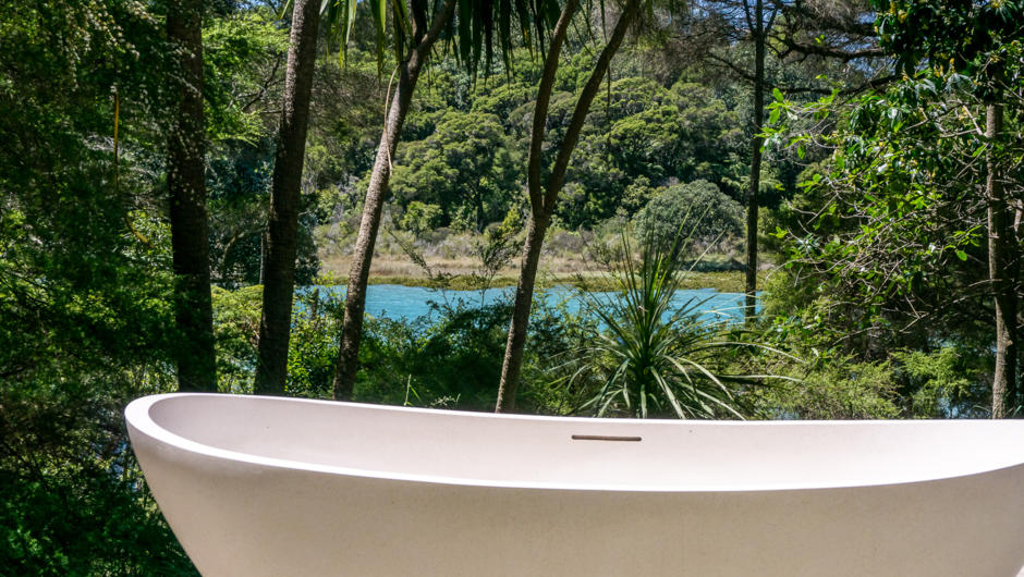 Wainui Seaside Glamping Barn: Outdoor Bath - enjoy seaviews during the day or bath under the stars in the evening in your private outdoor bath.