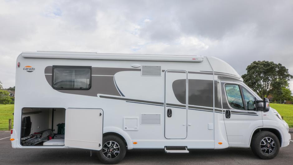 Luxury motorhomes with outdoor awnings and massive outdoor storage capacity.