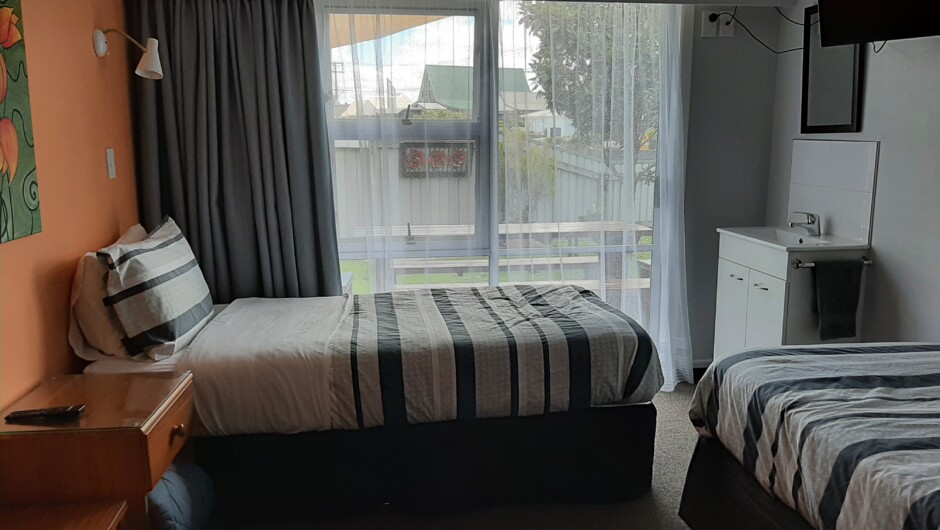 We have 3 twin singles which all have a vanity, a TV, phone charging units and a place to hang some clothes. Two of these rooms  have access to the Garden Rooms 3 and 4.