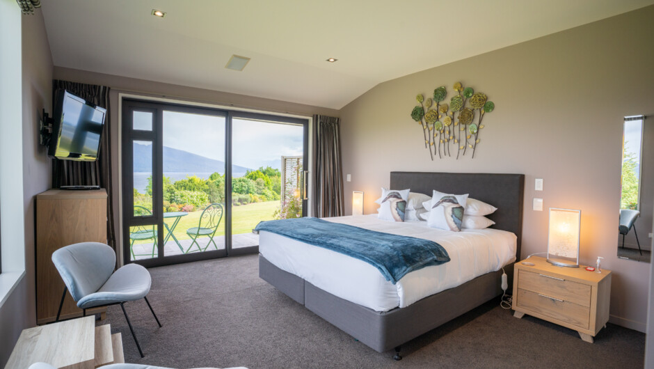 Our beautiful Luxmore room features a super king bed and terrace where you can take in the lake and garden views. The ensuite has a walk in shower, underfloor heating and a heated towel rail.