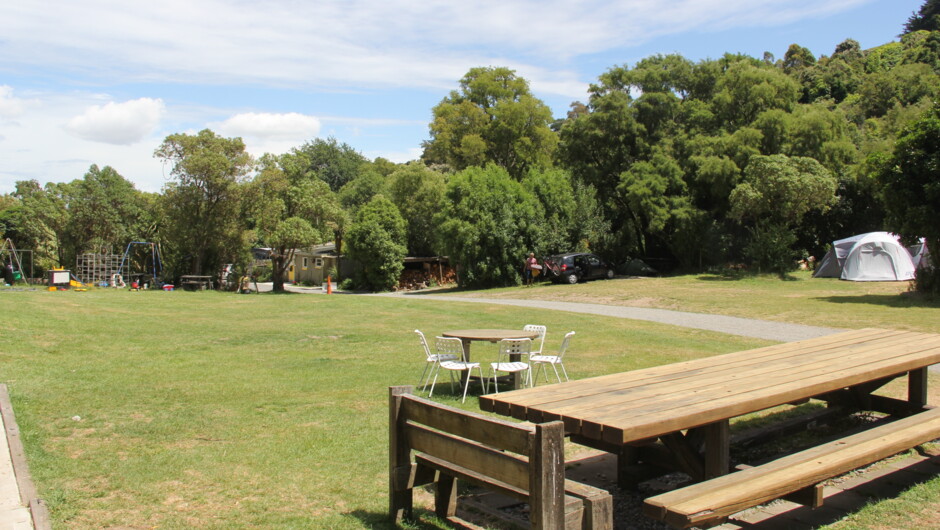 We have a nice grass area for kids to play, plus a huge picnic table for guests to use, just beside the outdoor kitchen.