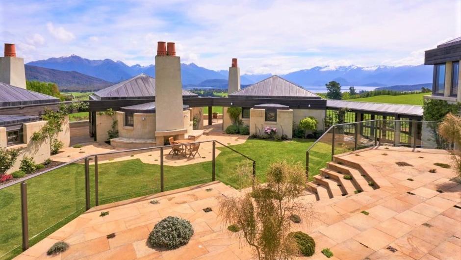 Interior courtyard at Cabot Lodge, overlooking Lake Manapouri and the Cathedral Peak Mountains.