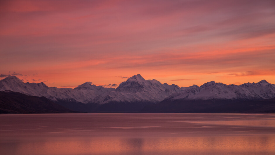 From the top of Lake Pukaki a popular spot to pullover for both sunrise and sunset hues
