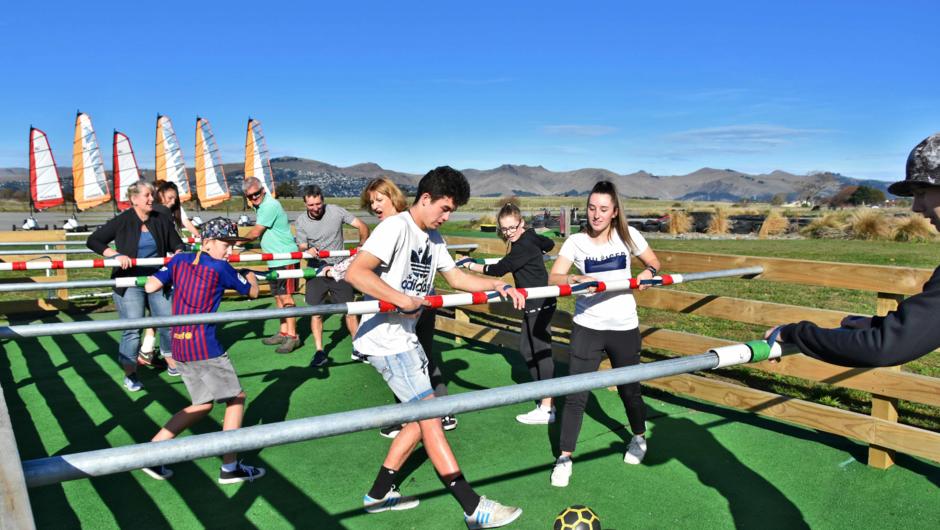 Human Foosball. For groups of 6 and above, just like table foosball only YOU kick the ball. Laugh-out-loud action from beginning to end.