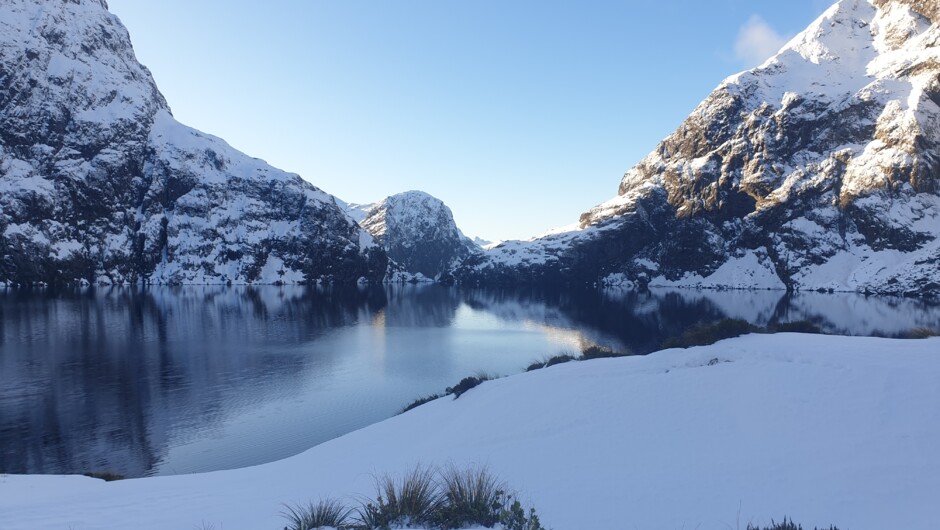 Fresh snowfall at Lake Quill, one of our tranquil landing locations close to Milford Sound.