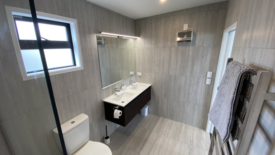 Large heated fully tiled ensuite bathrooms.