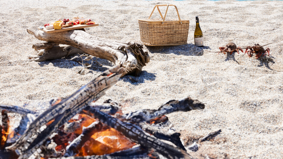 Fire and picnic basket on your secluded West Coast beach