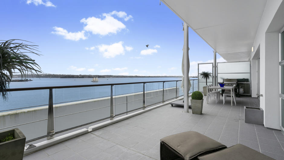 Super spacious covered balcony overlooking the water