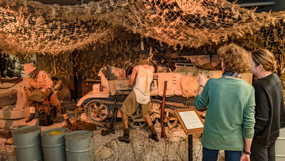 Dramatic dioramas depict various military scenes, from the heat of the battle to quiet moments in the trenches.