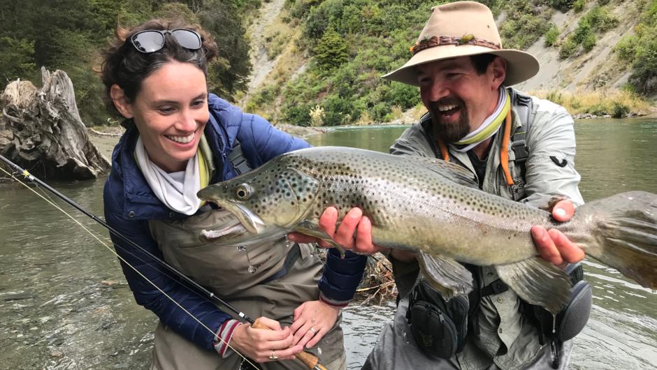 Scotty with client Ingrid and her fish of the day caught during a guided fly fishing day on a Fiordland stream.