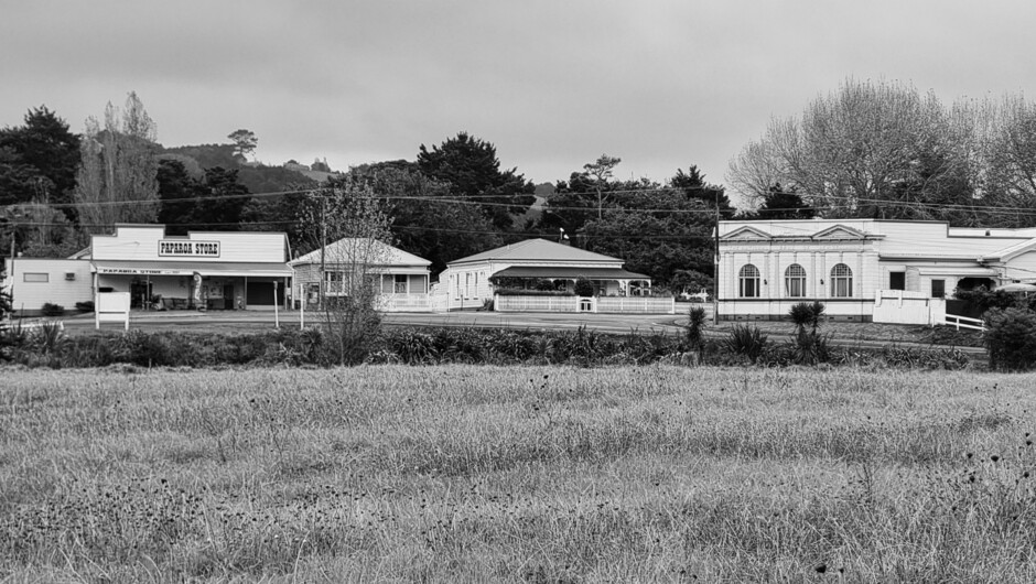 The Lodge is across the road from the Heritage 1 listed National Bank of New Zealand and next to the owners accommodation in an 1910 relocated villa.  The village store is to the left, and I can pop out and get wine and return before anyone notices.