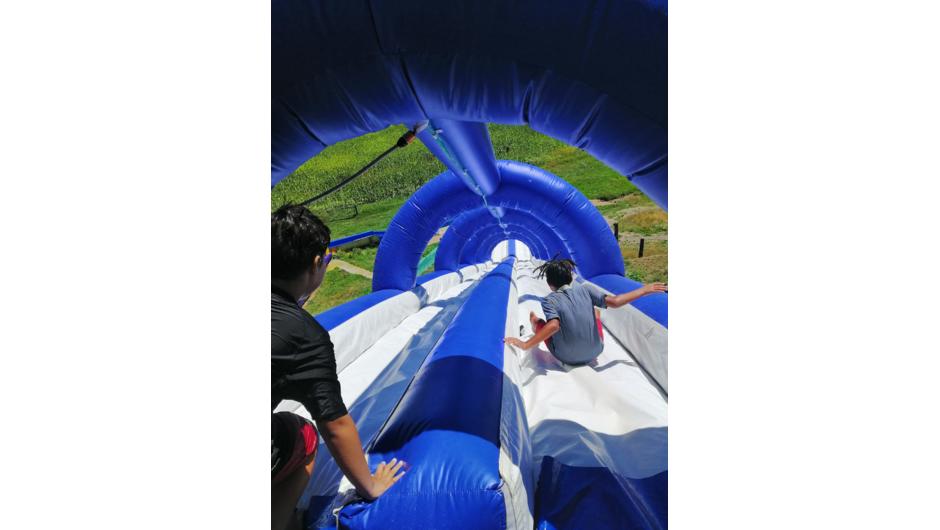 Race your friends to the bottom on the dual race waterslide.