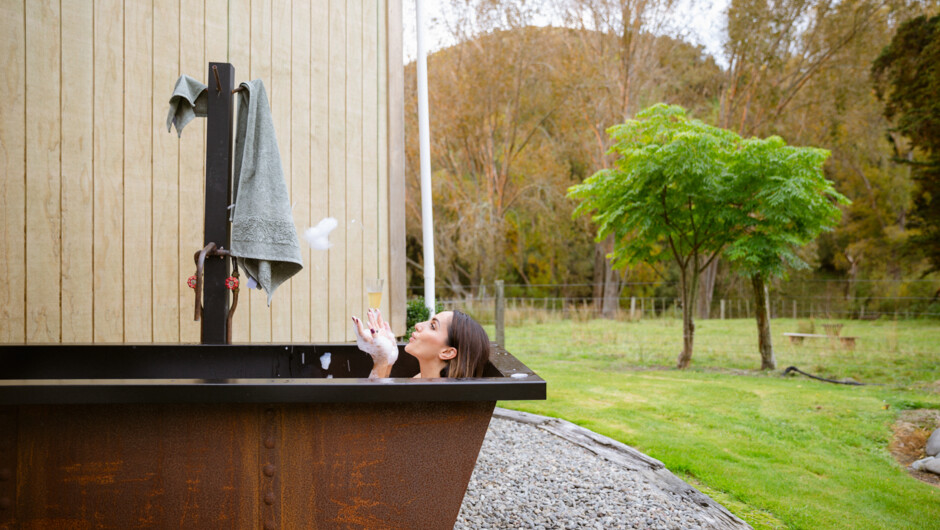 Relax in the large, private outdoor bath. Big enough for the family! A must-do at night while watching the stars.