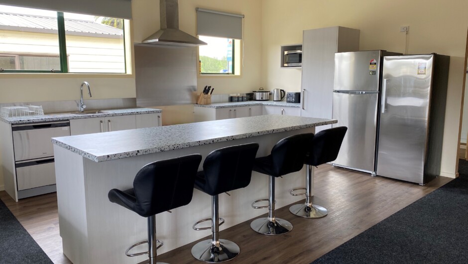The Lodge Kitchen.  Breakfast bar, dish draws, microwave, air fryer and two fridges and freezer.