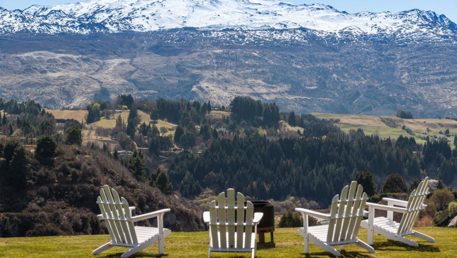 Large lawn with views of Coronet Peak and the Shotover River.