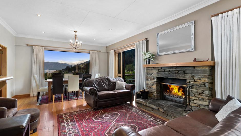 Lounge with fireplace and views over Queenstown