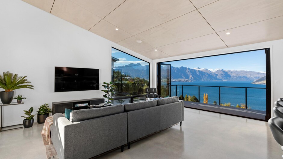 Lounge opens out to a private balcony with stunning lake views