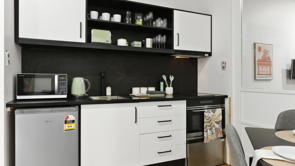 Kitchen comes fully equipped with modern appliances and cooking essentials