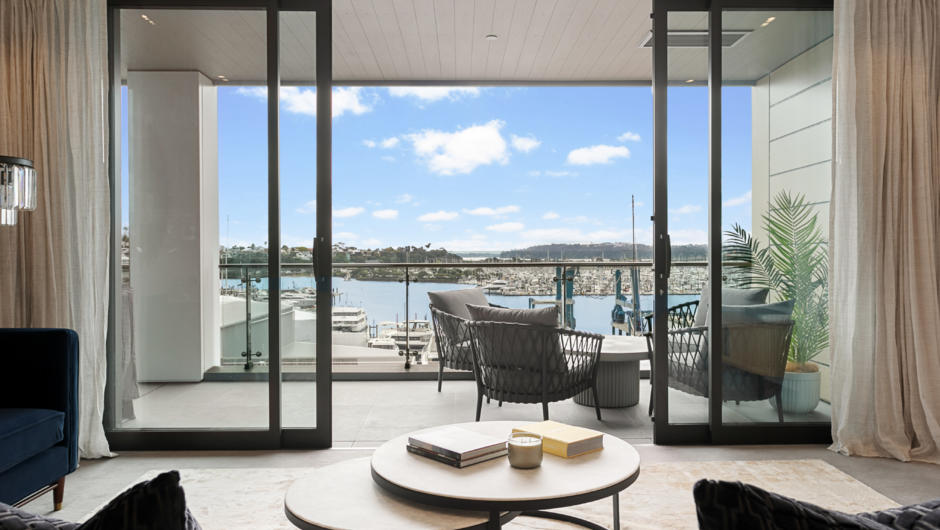 Enjoy stunning views of the waterfront from the balcony and living area