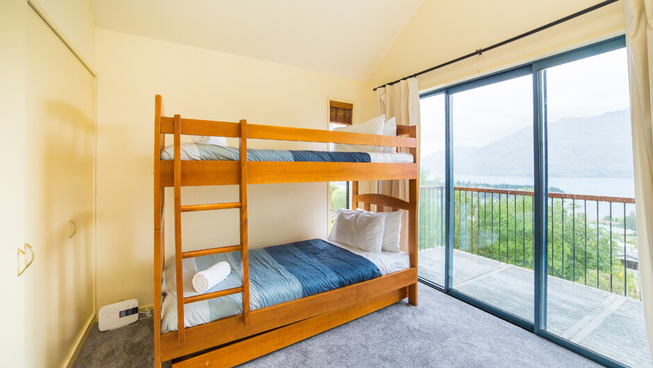 Bunk bedroom with balcony access