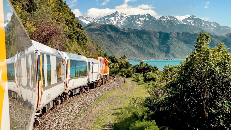 The Coastal Pacific train travelling on ruggest coastline between Christchurch and Picton.