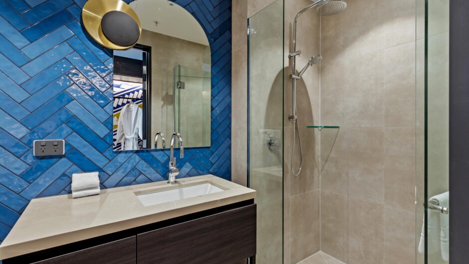 Modern bathrooms. Suites include double sinks and bathtubs.