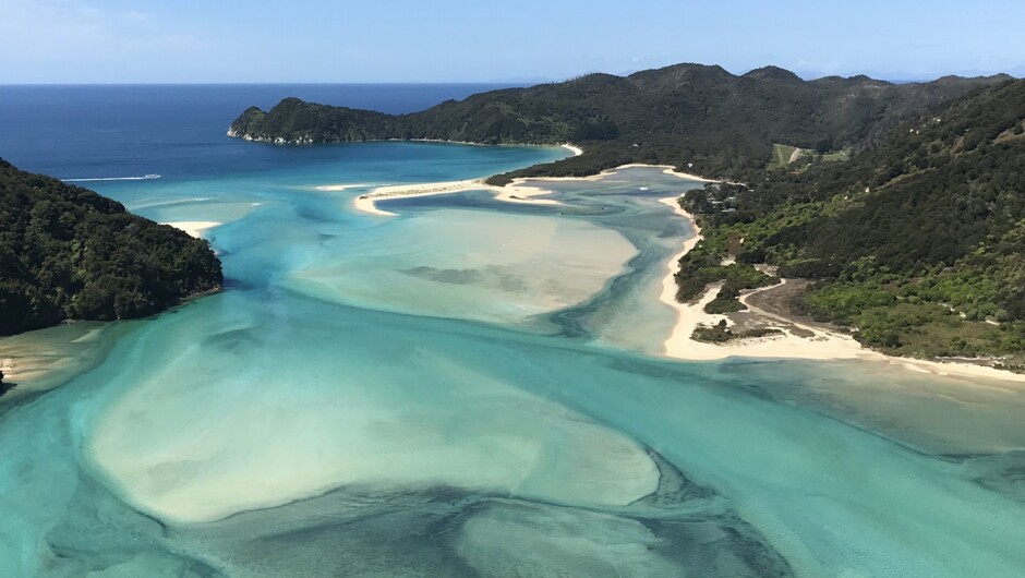 Calm blue waters of Awaroa Bay in Abel Tasman